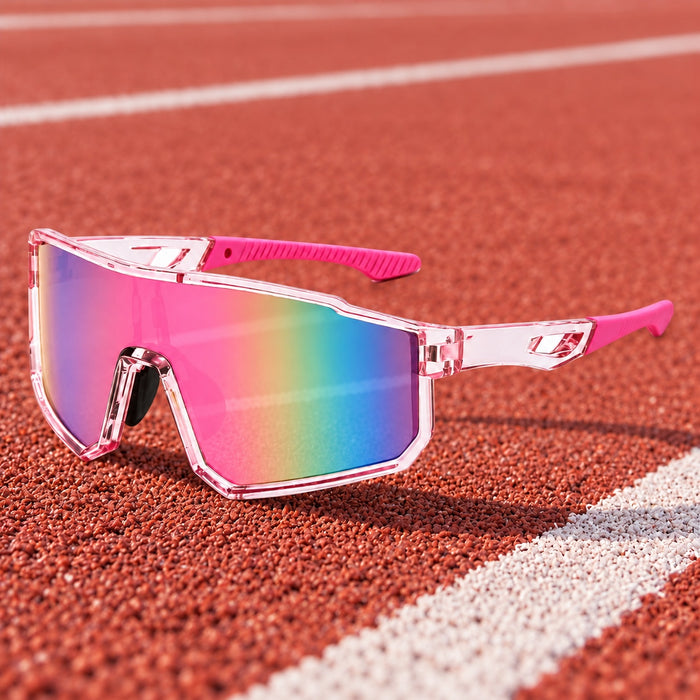 Pink Shield Sport sunglasses resting on a running track