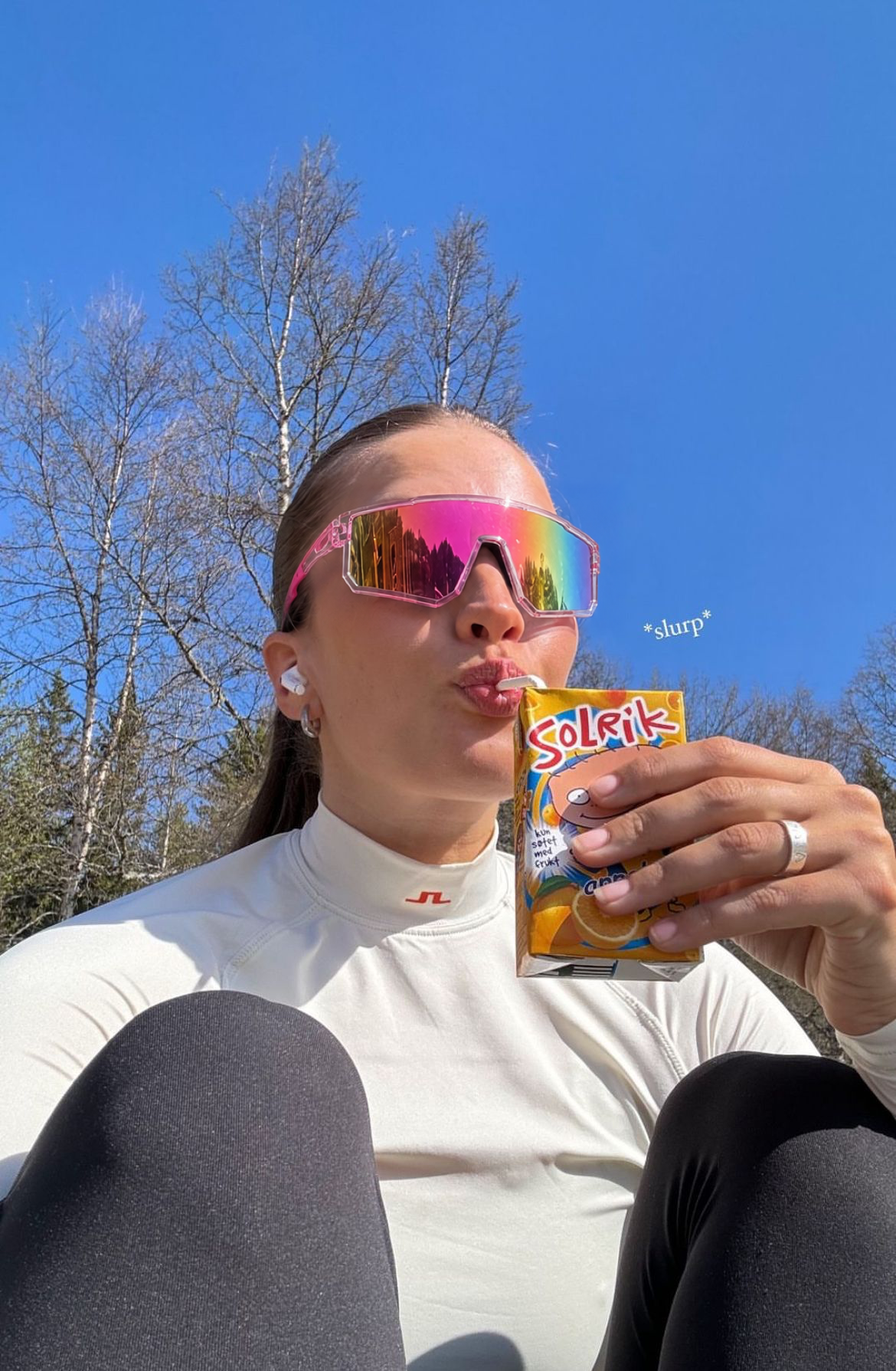 Pink Shield Sport glasses worn outdoors